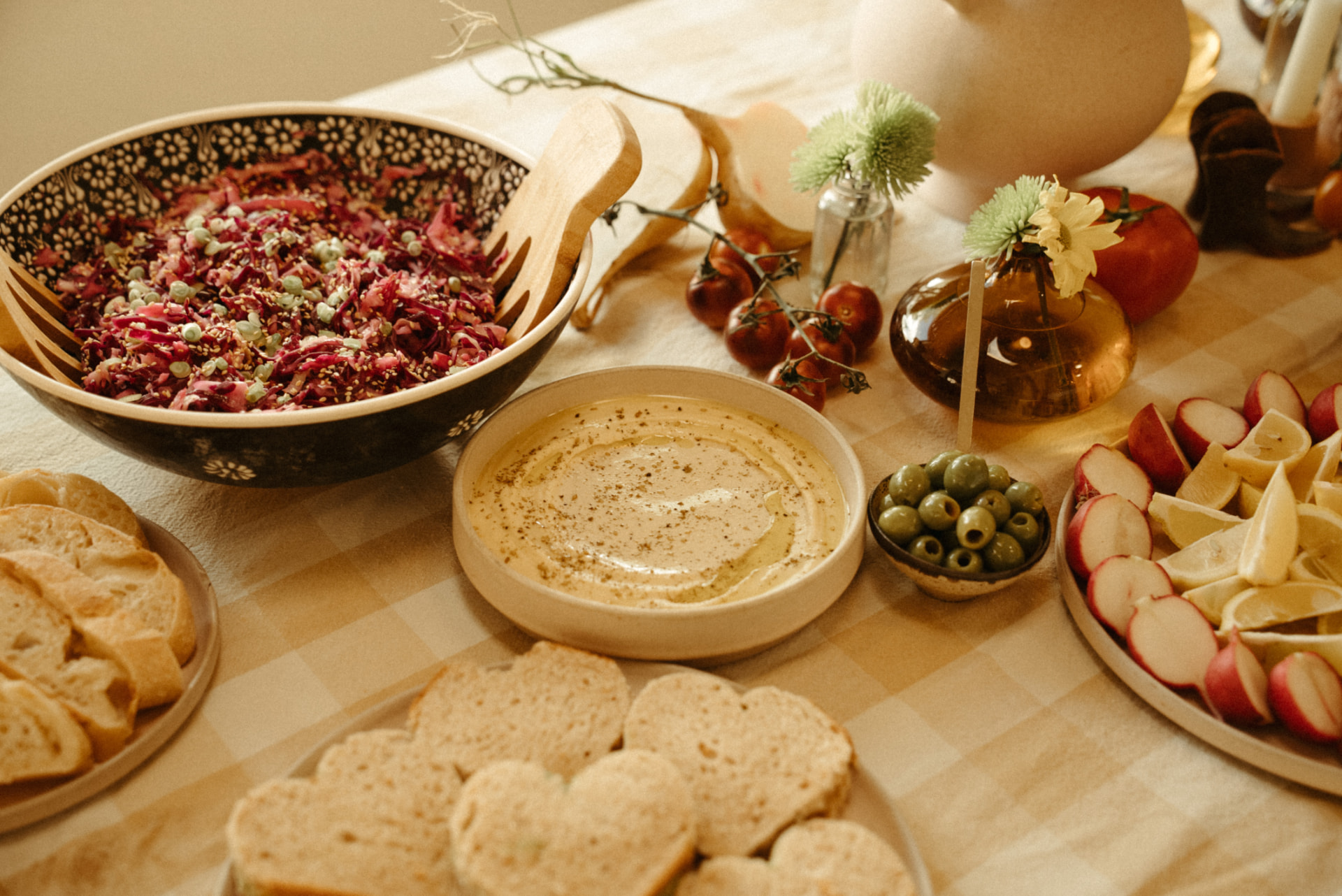 Mezze table with radicchio salad, hummus, olives and grilled bread